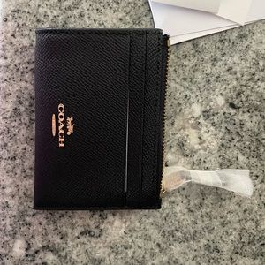 Coach coin purse. Black leather. New with tags.